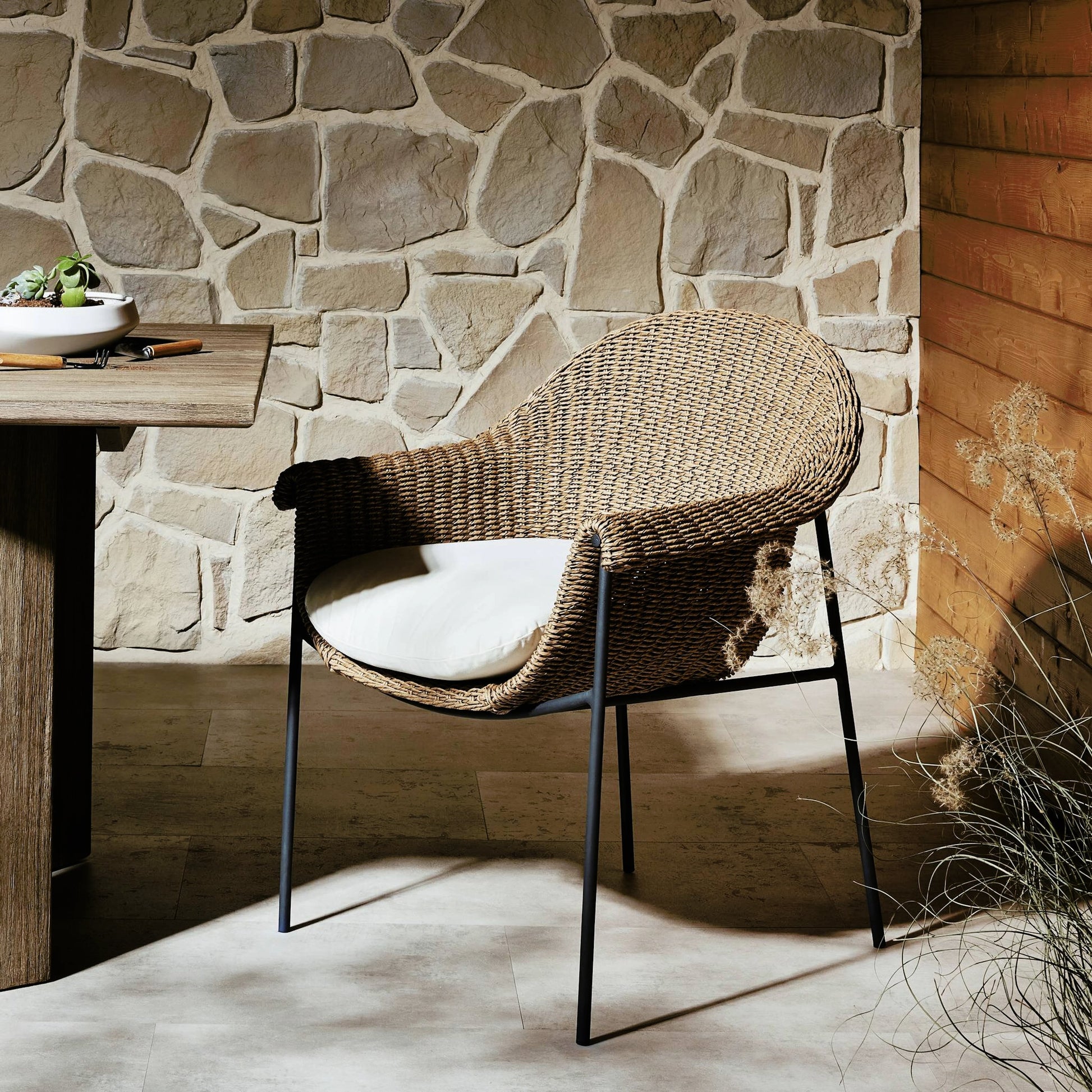 Suerte Outdoor Dining Chair by Four Hands. Made from 100% acrylic, iron, 100% polyethylene in a modern style.