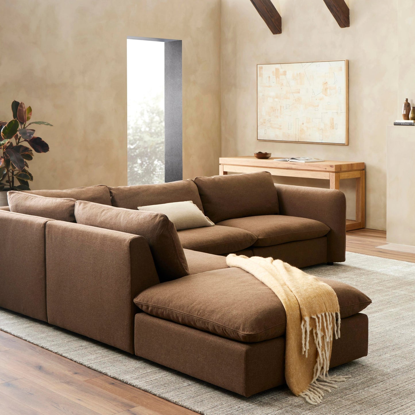004 SI-2074379 | Lifestyle | Ingel 4-Piece Sectional with Ottoman by Four Hands in antwerp cafe. Made from 39% linen, 35% cotton, 26% polyester, poplar plywood, 100% polyester in a modern style.