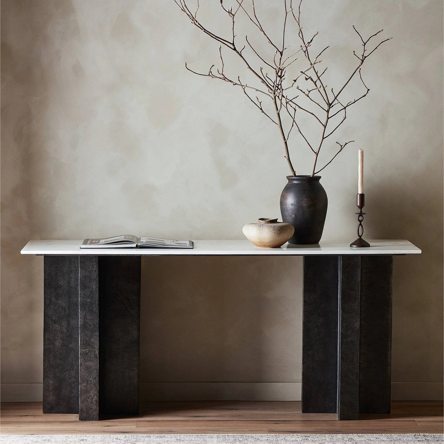 018 SI-2137625 | Lifestyle | Terrell Large Console Table by Four Hands in polished white marble, raw black. Made from solid marble, aluminum, engineered hardwood in a modern style.