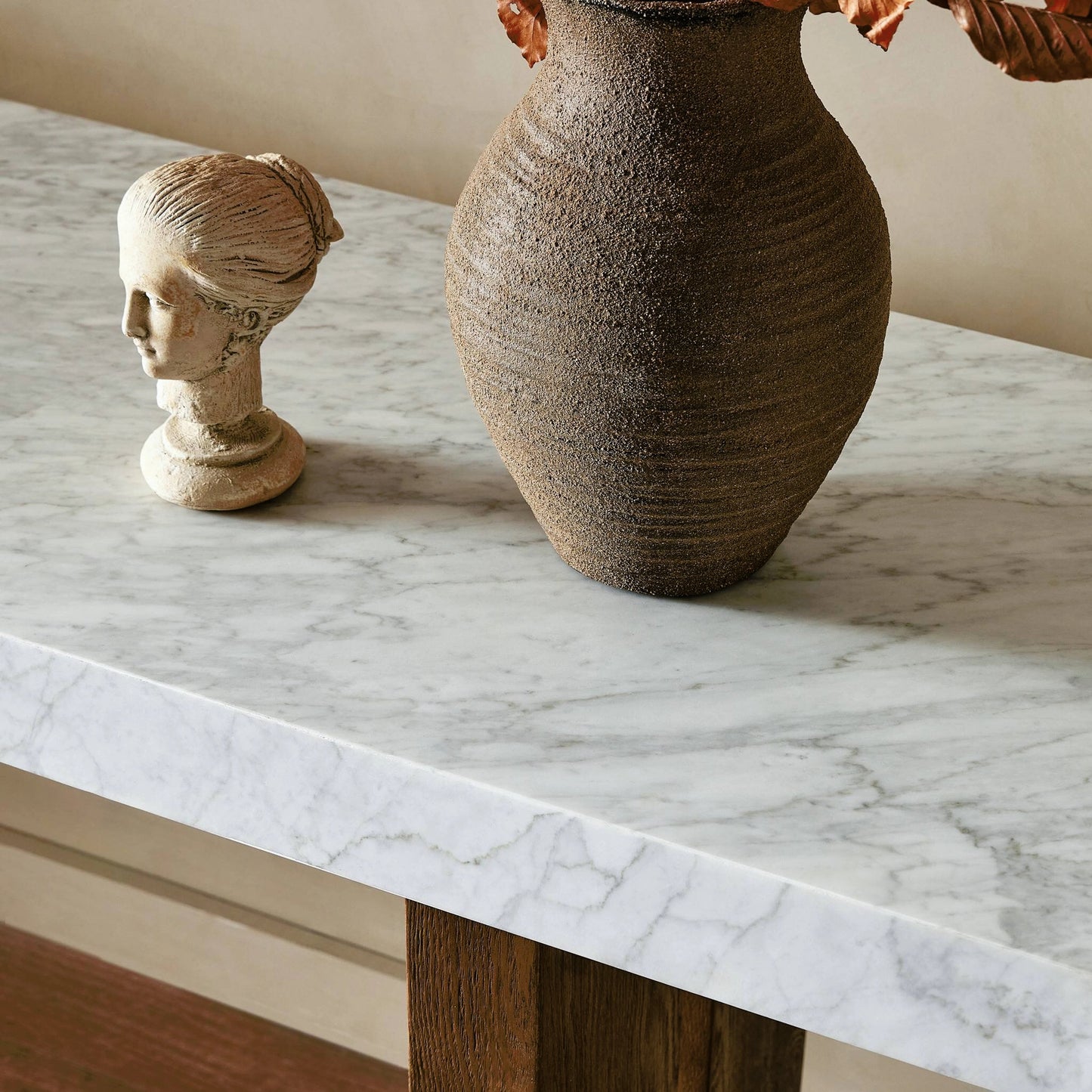 011 SI-2158364 | Closeup | Olympia Console Table by Four Hands in white carrara marble, smoked oak veneer and white carrara marble. Made from carrara solid, thick oak veneer, poplar plywood in a modern style.