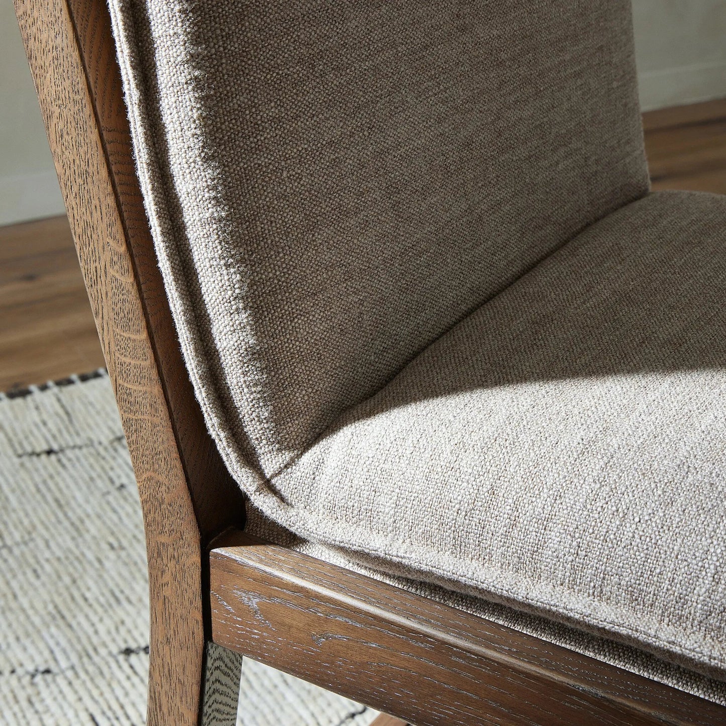 011 SI-2137724 | Closeup | Wilmington Counter Stool by Four Hands in alcala fawn and almond nettlewood, sonoma coco. Made from 70% polyester, 20% viscose (rayon), 10% flax, linen, solid nettlewood, top grain leather in a modern style.