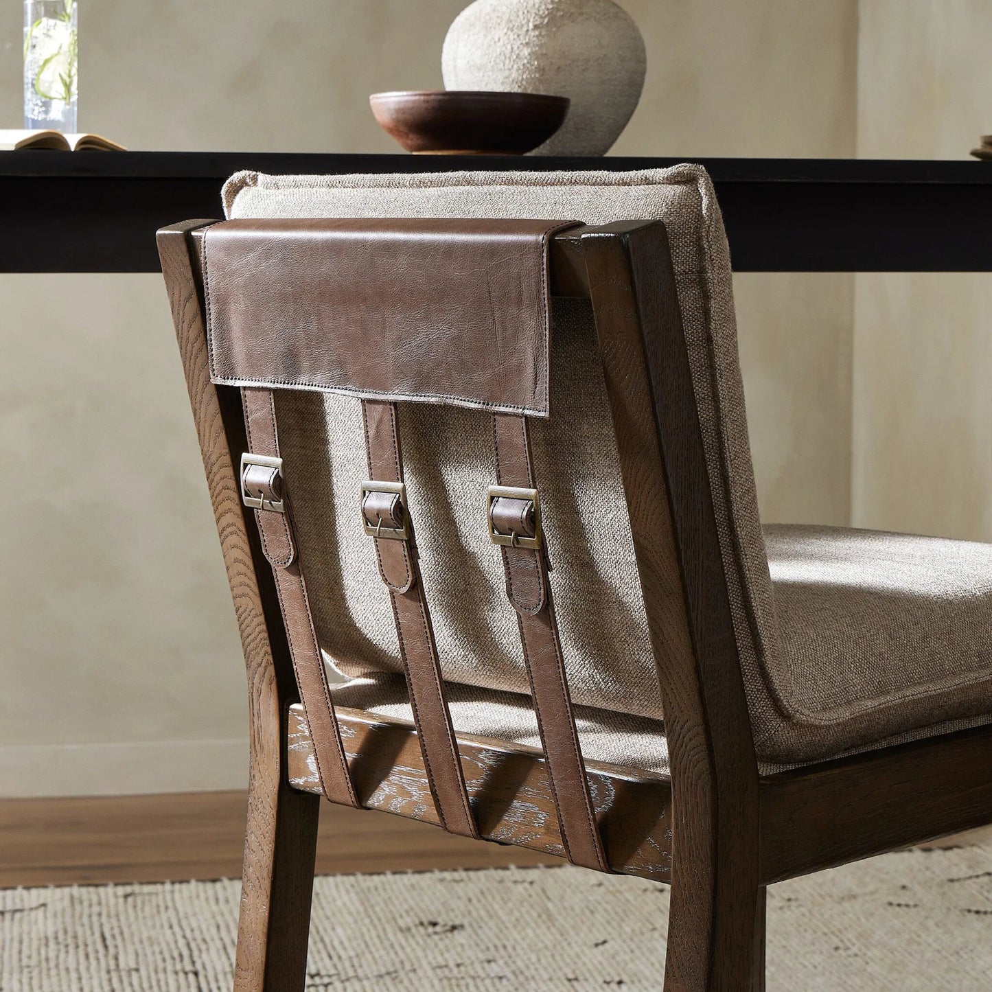 010 SI-2137724 | Closeup | Wilmington Counter Stool by Four Hands in alcala fawn and almond nettlewood, sonoma coco. Made from 70% polyester, 20% viscose (rayon), 10% flax, linen, solid nettlewood, top grain leather in a modern style.