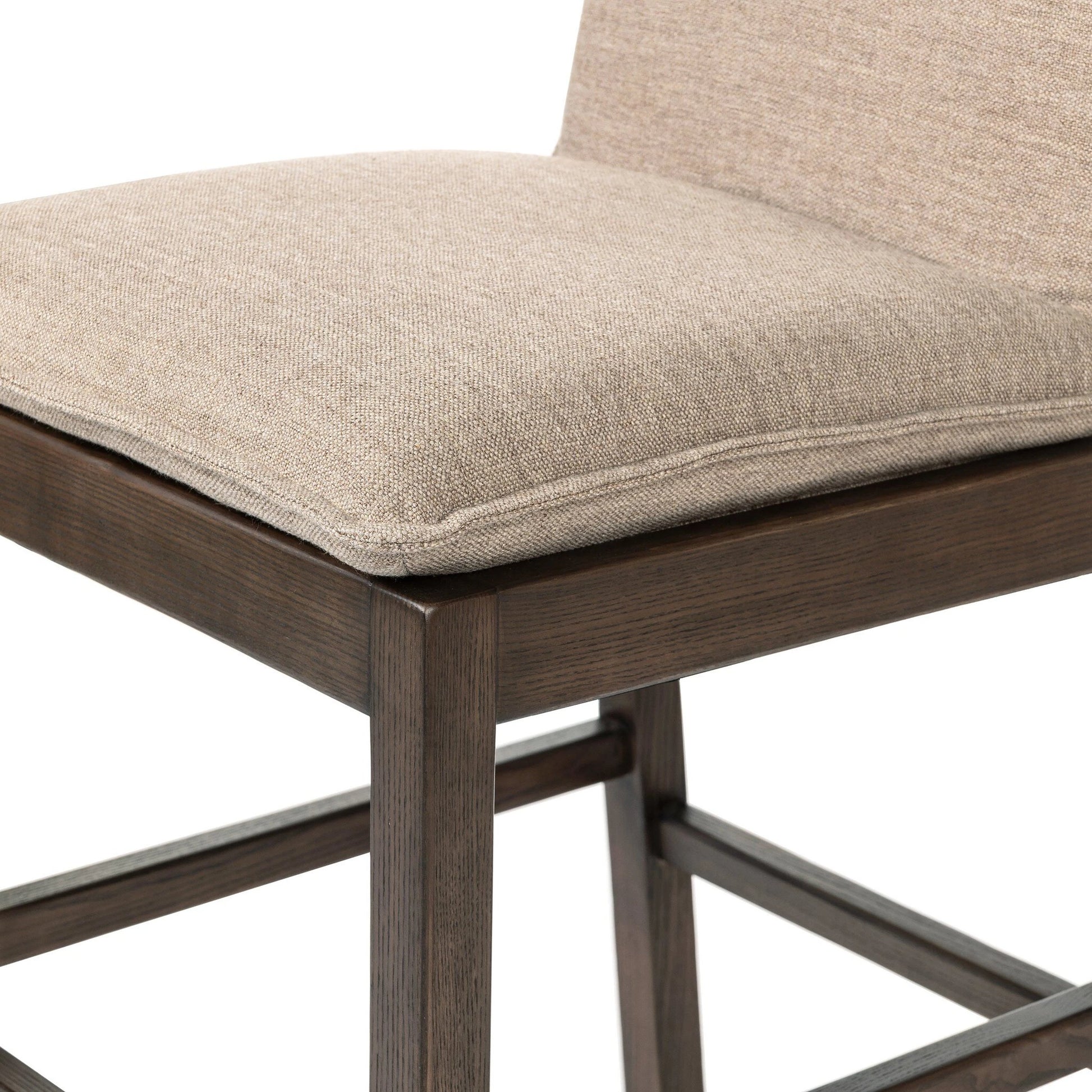 Wilmington Counter Stool by Four Hands in alcala fawn and almond nettlewood, sonoma coco. Made from 70% polyester, 20% viscose (rayon), 10% flax, linen, solid nettlewood, top grain leather in a modern style.