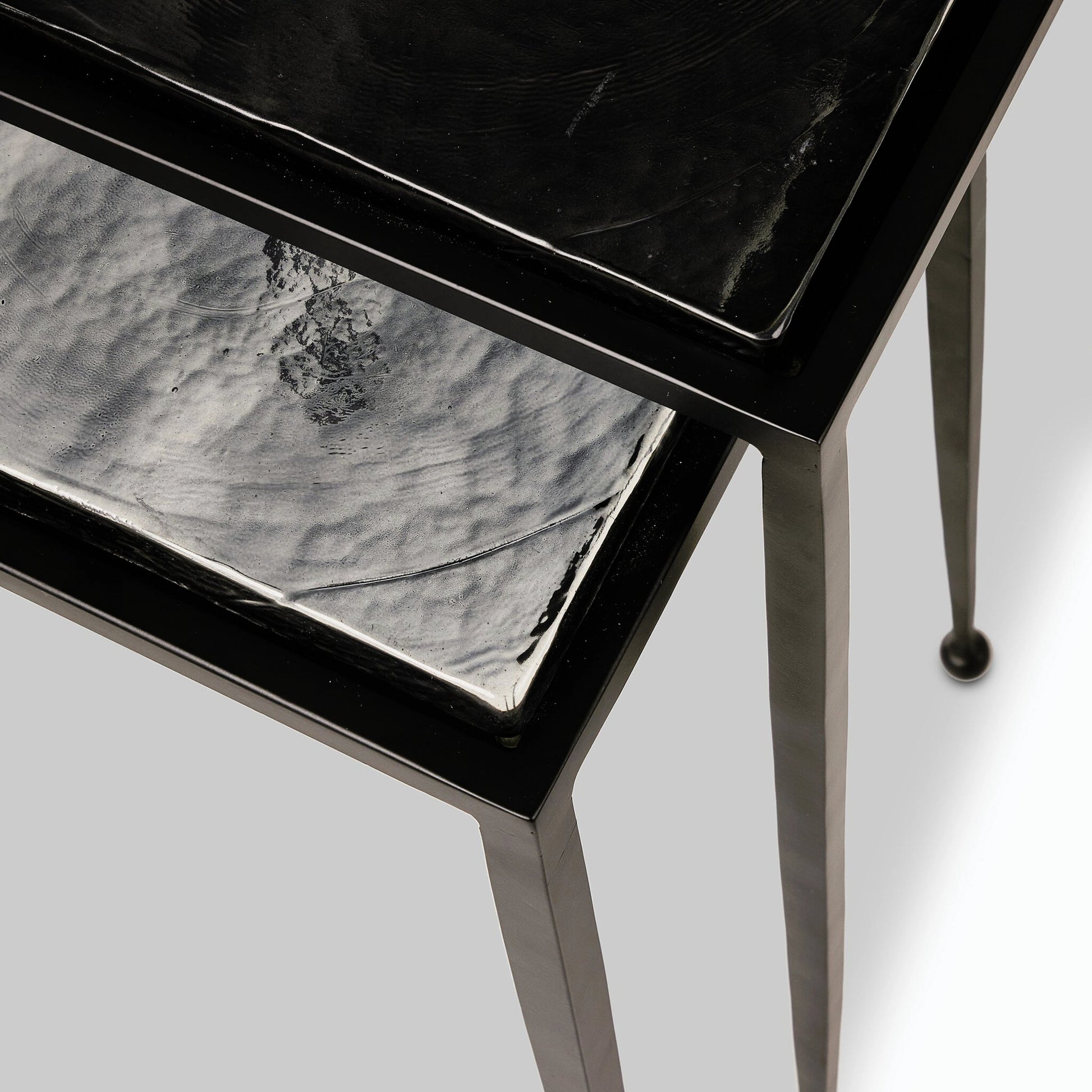 Dalston Cast Glass Nesting Tables by Four Hands in smoked black cast glass, iron matte black. Made from cast glass, iron in a modern style.