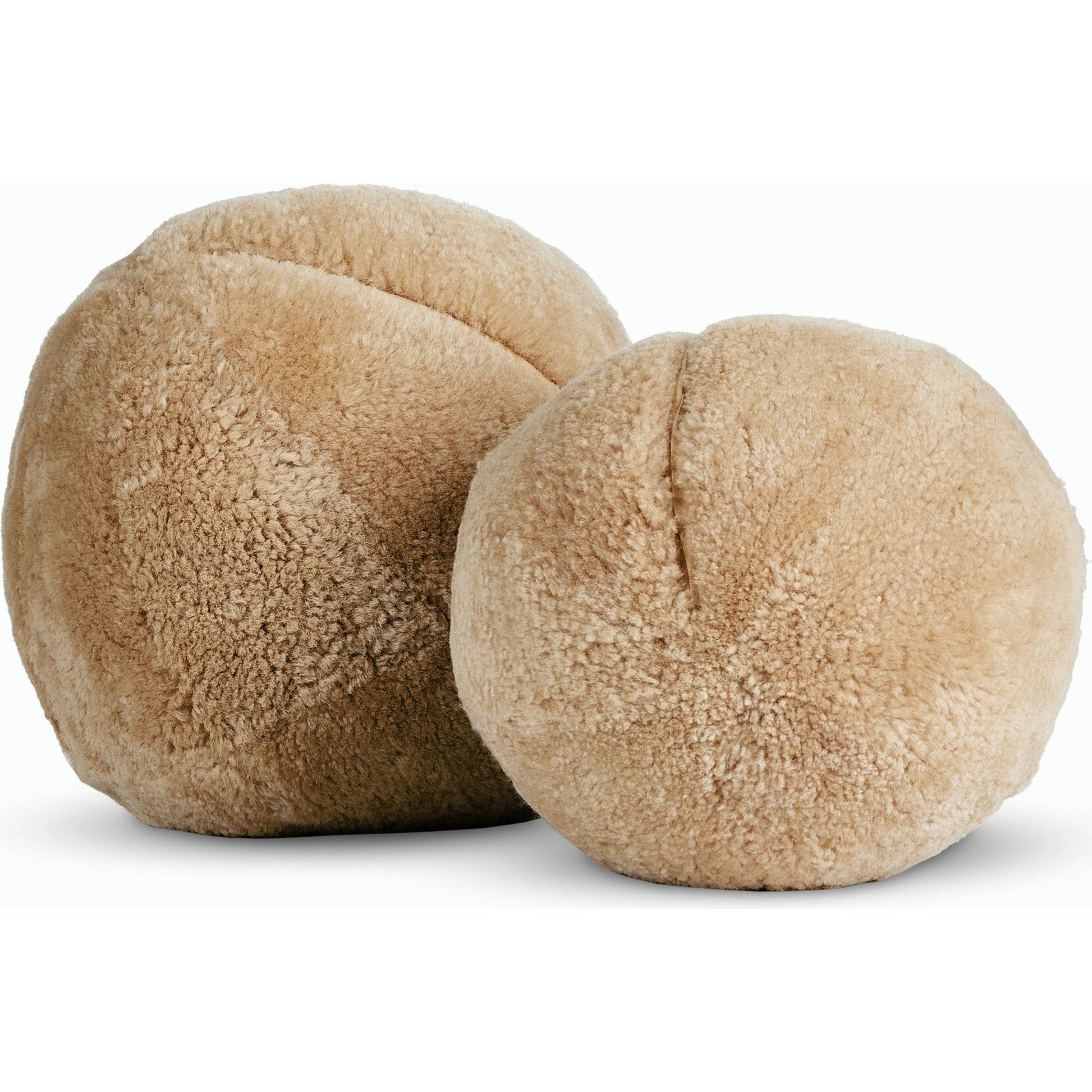 Balle Shearling Pillow Set by Four Hands in white shorn sheepskin. Made from 100% sheared sheepskin, down alternative fiber, 100% polyester in a transitional style.