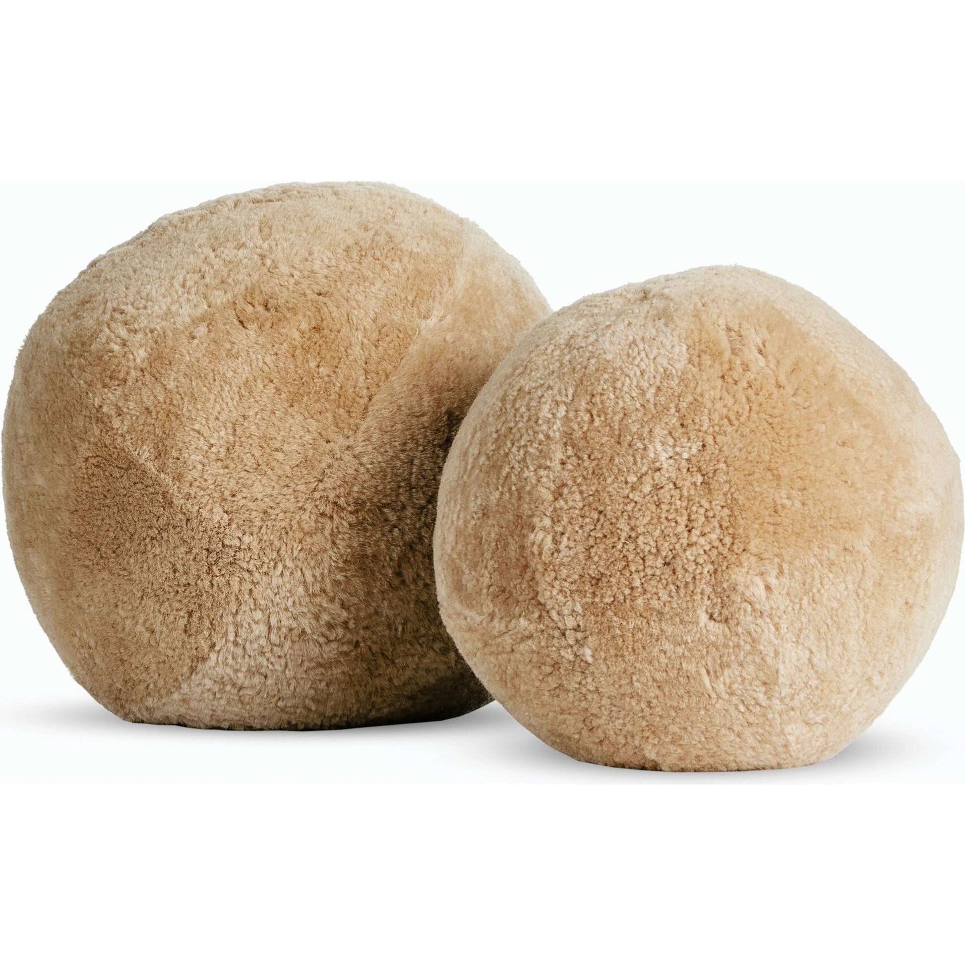 Balle Shearling Pillow Set by Four Hands in white shorn sheepskin. Made from 100% sheared sheepskin, down alternative fiber, 100% polyester in a transitional style.