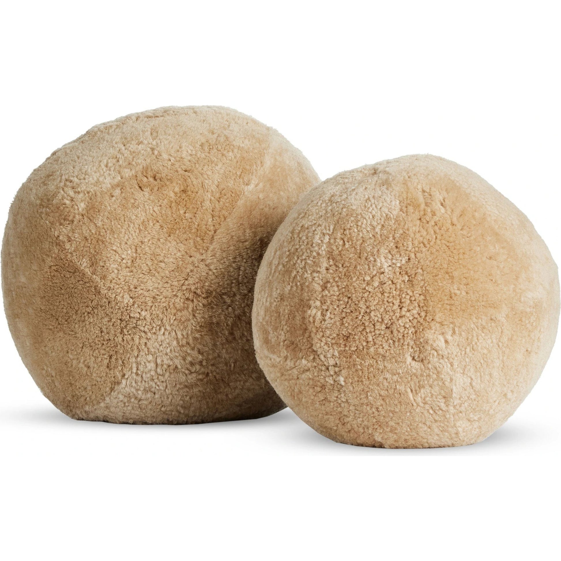 Balle Shearling Pillow Set by Four Hands in white shorn sheepskin. Made from 100% sheared sheepskin, down alternative fiber, 100% polyester in a transitional style.