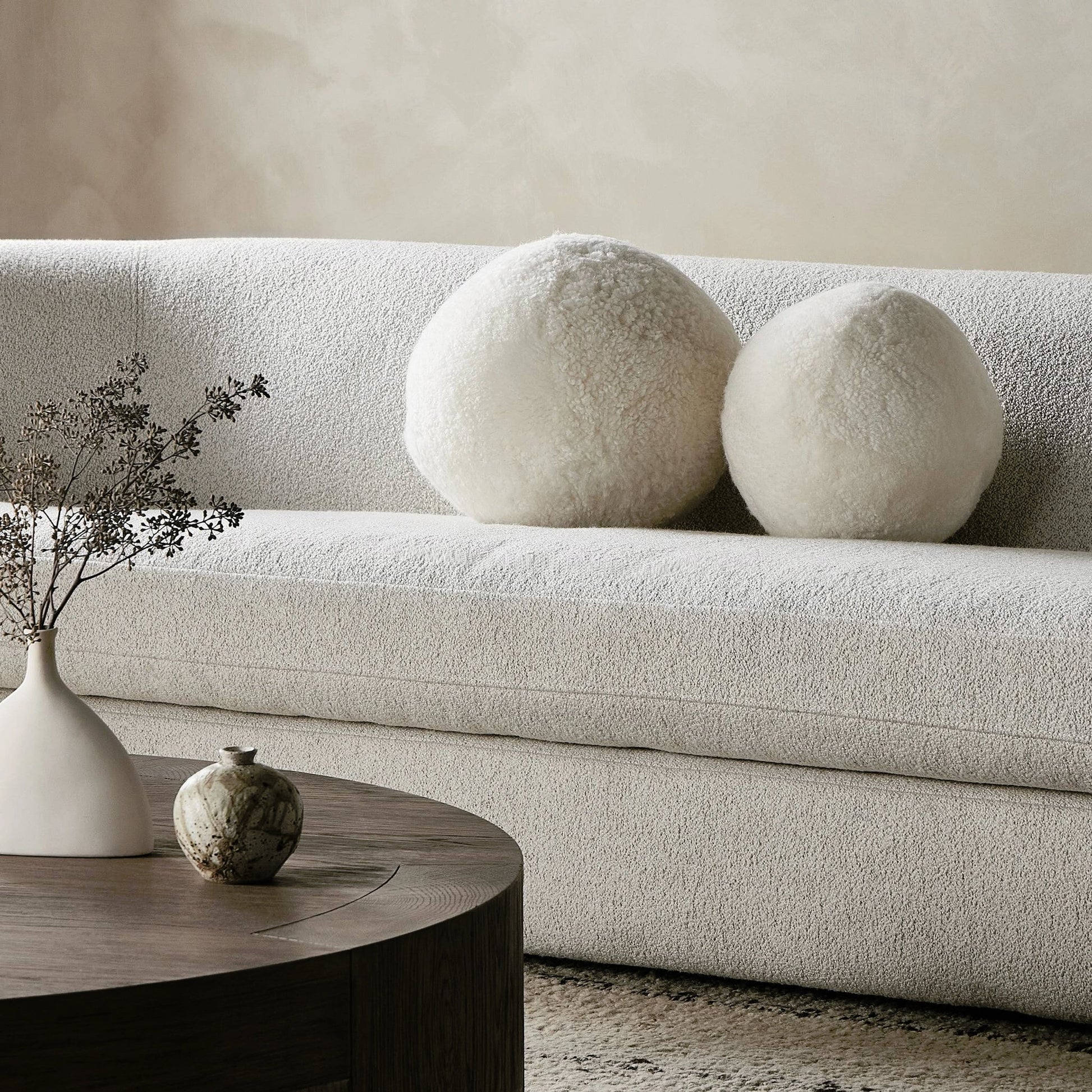 Balle Shearling Pillow Set by Four Hands in white shorn sheepskin. Made from 100% sheared sheepskin, down alternative fiber, 100% polyester in a transitional style.