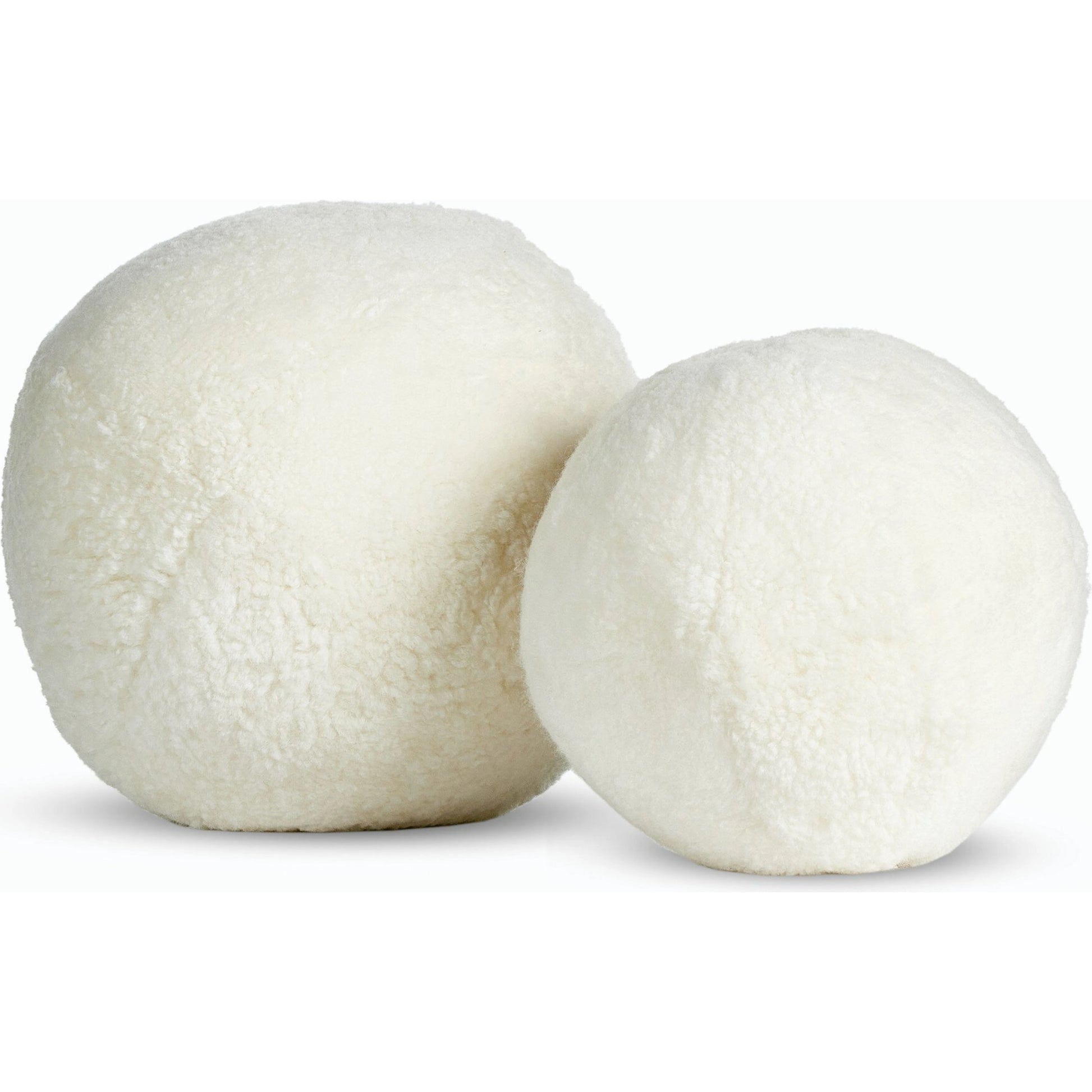 Balle Shearling Pillow Set by Four Hands in white shorn sheepskin. Made from 100% sheared sheepskin, down alternative fiber, 100% polyester in a transitional style.