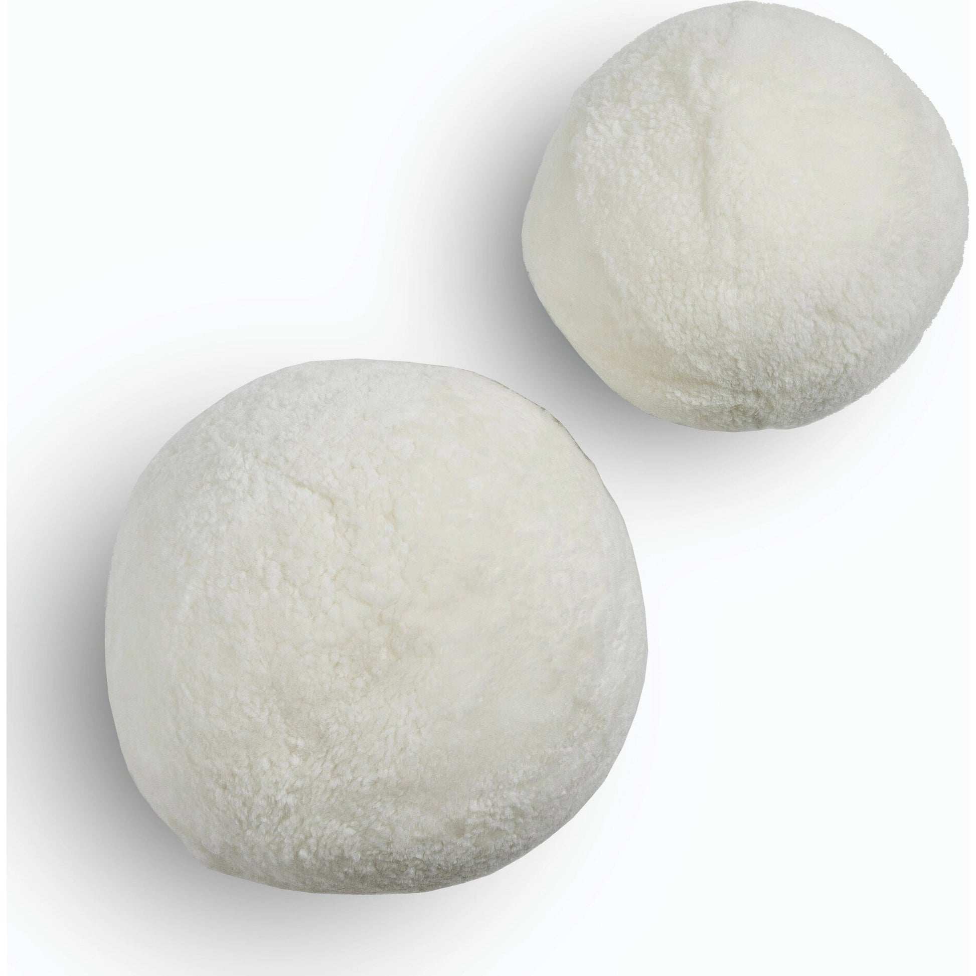 Balle Shearling Pillow Set by Four Hands in white shorn sheepskin. Made from 100% sheared sheepskin, down alternative fiber, 100% polyester in a transitional style.