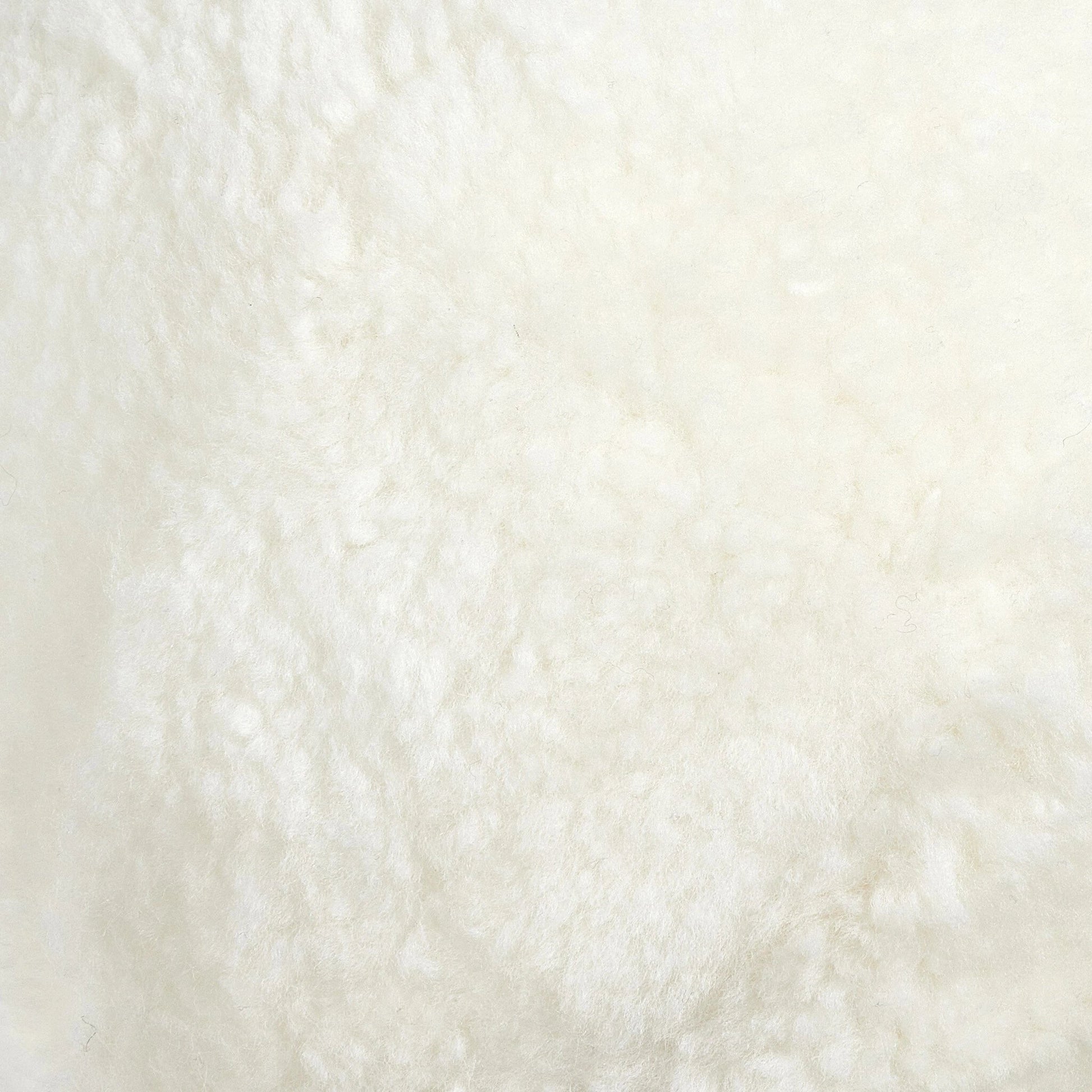 Balle Shearling Pillow Set by Four Hands in white shorn sheepskin. Made from 100% sheared sheepskin, down alternative fiber, 100% polyester in a transitional style.