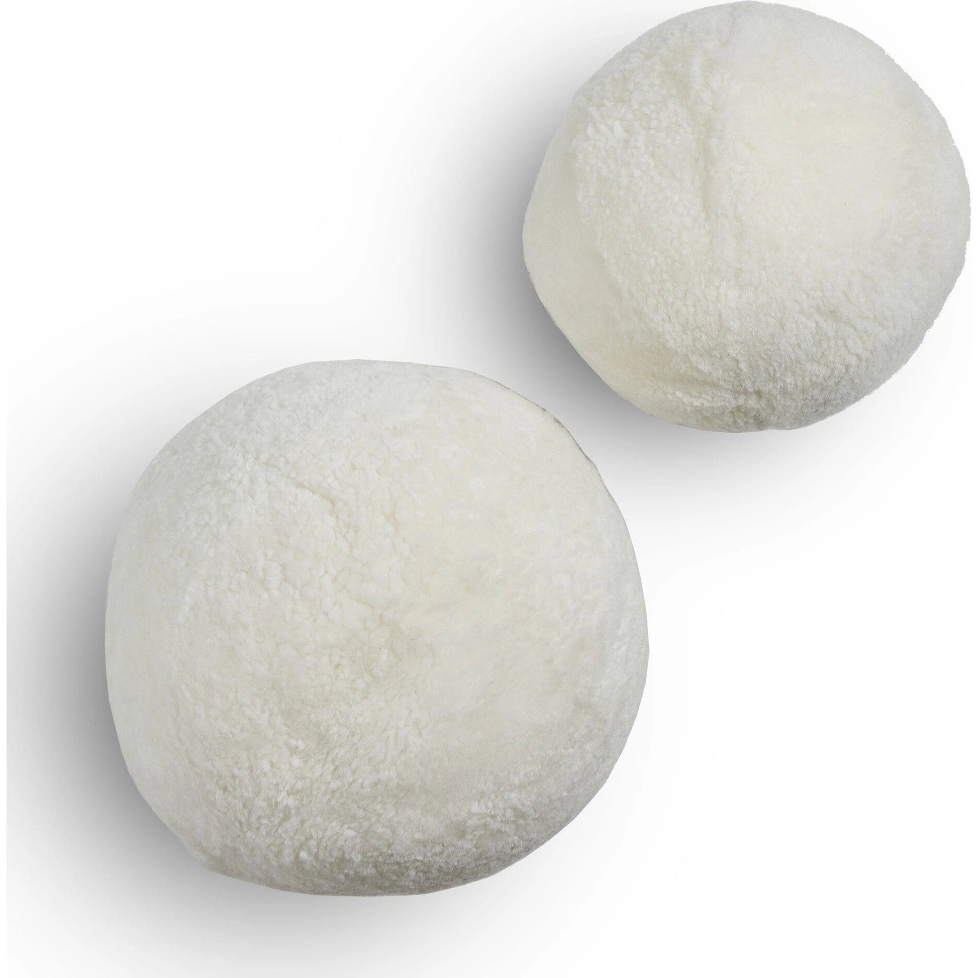 Balle Shearling Pillow Set by Four Hands in white shorn sheepskin. Made from 100% sheared sheepskin, down alternative fiber, 100% polyester in a transitional style.