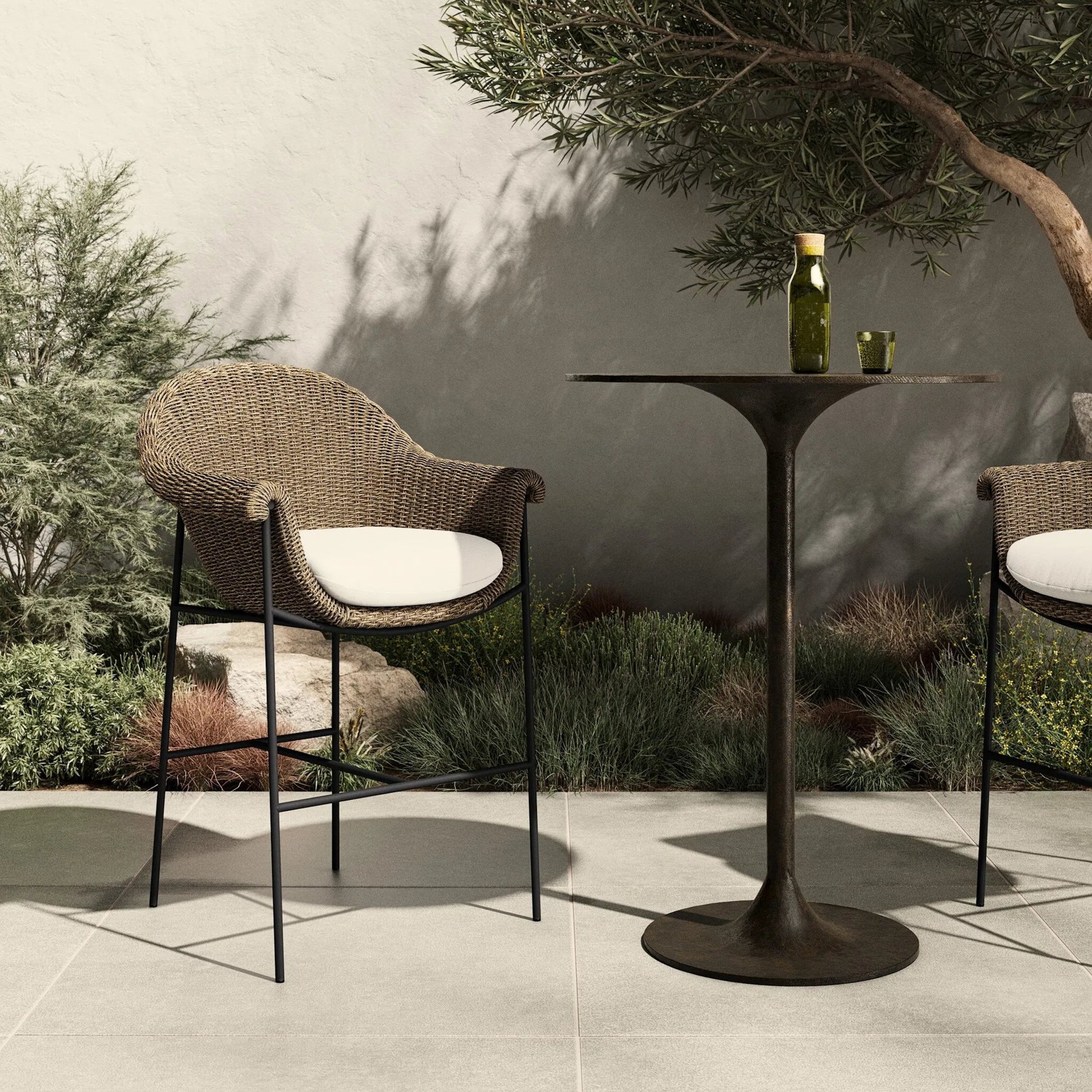 Suerte Outdoor Bar Stool by Four Hands. Made from 100% acrylic, iron, 100% polyethylene in a unique style.