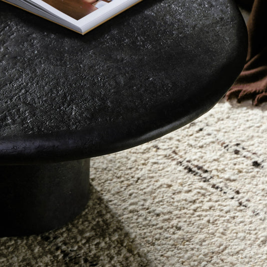 Bonnie Coffee Table by Four Hands in textured black concrete. Made from concrete in a modern style.