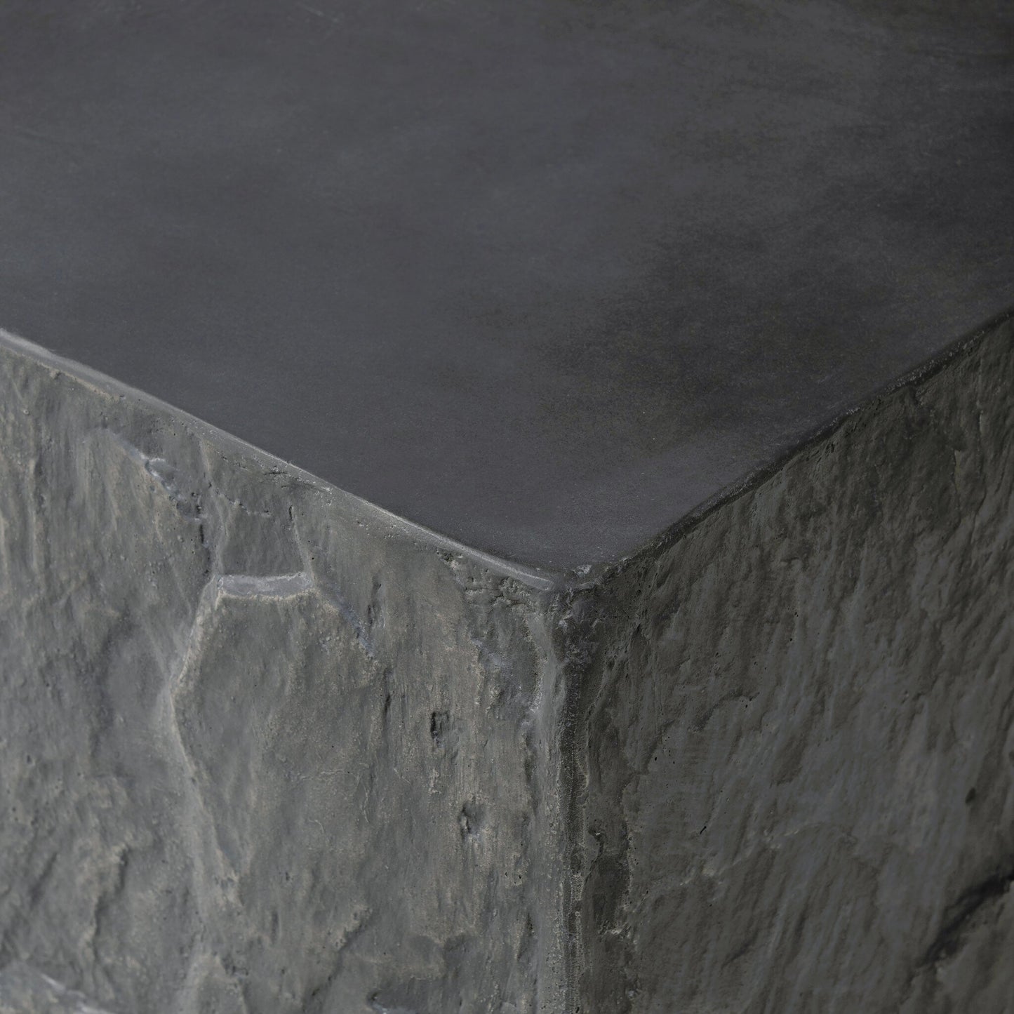005 SI-2158285 | Closeup | Lucius End Table by Four Hands in smooth black concrete, textured black concrete and smooth black concrete. Made from concrete in a modern style.