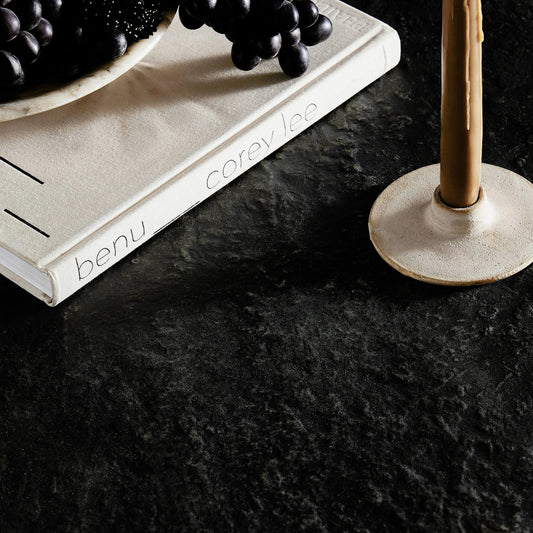 Bonnie Dining Table by Four Hands in textured black concrete. Made from concrete in a modern style.