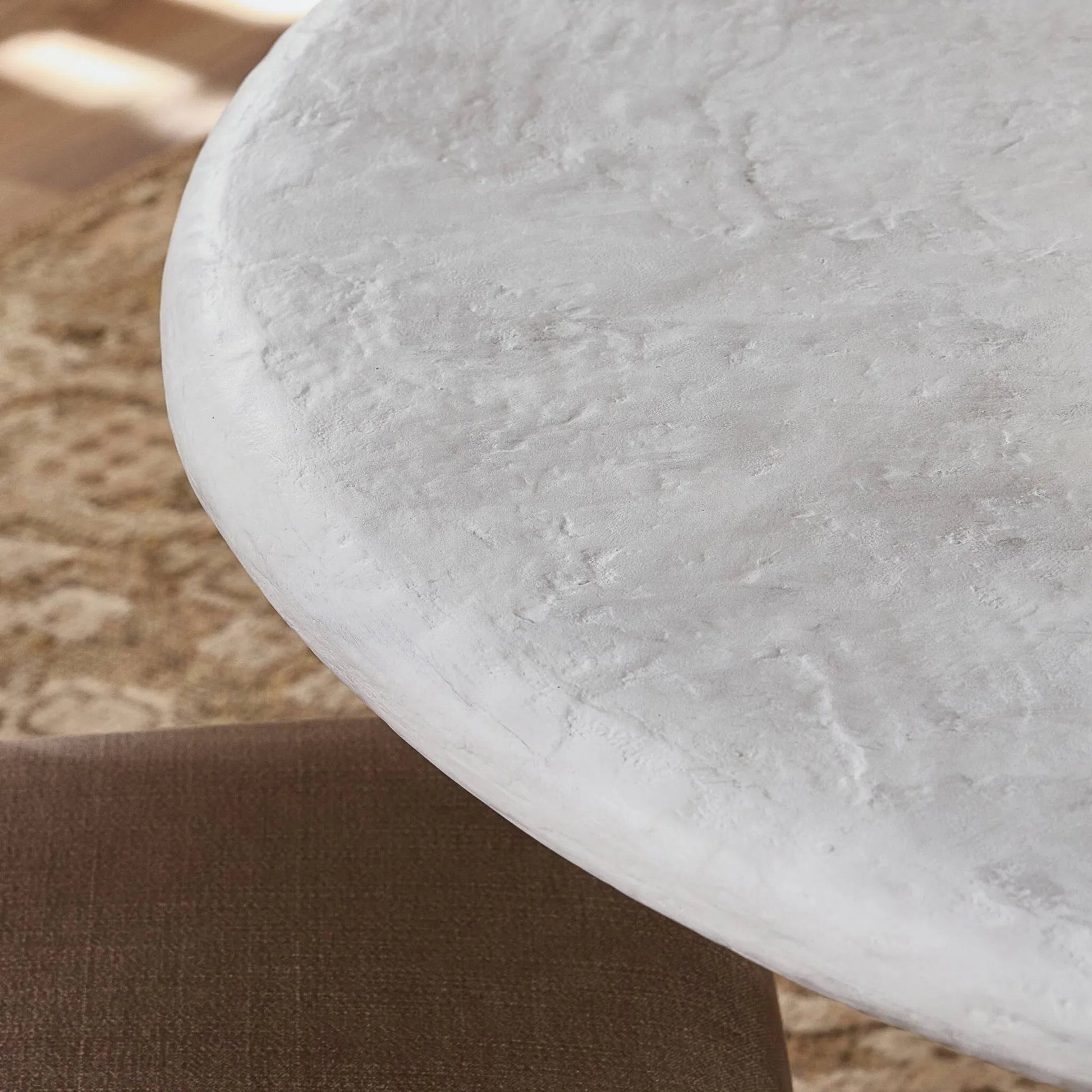 Janice Dining Table by Four Hands in textured lunar concrete. Made from solid concrete in a transitional style.