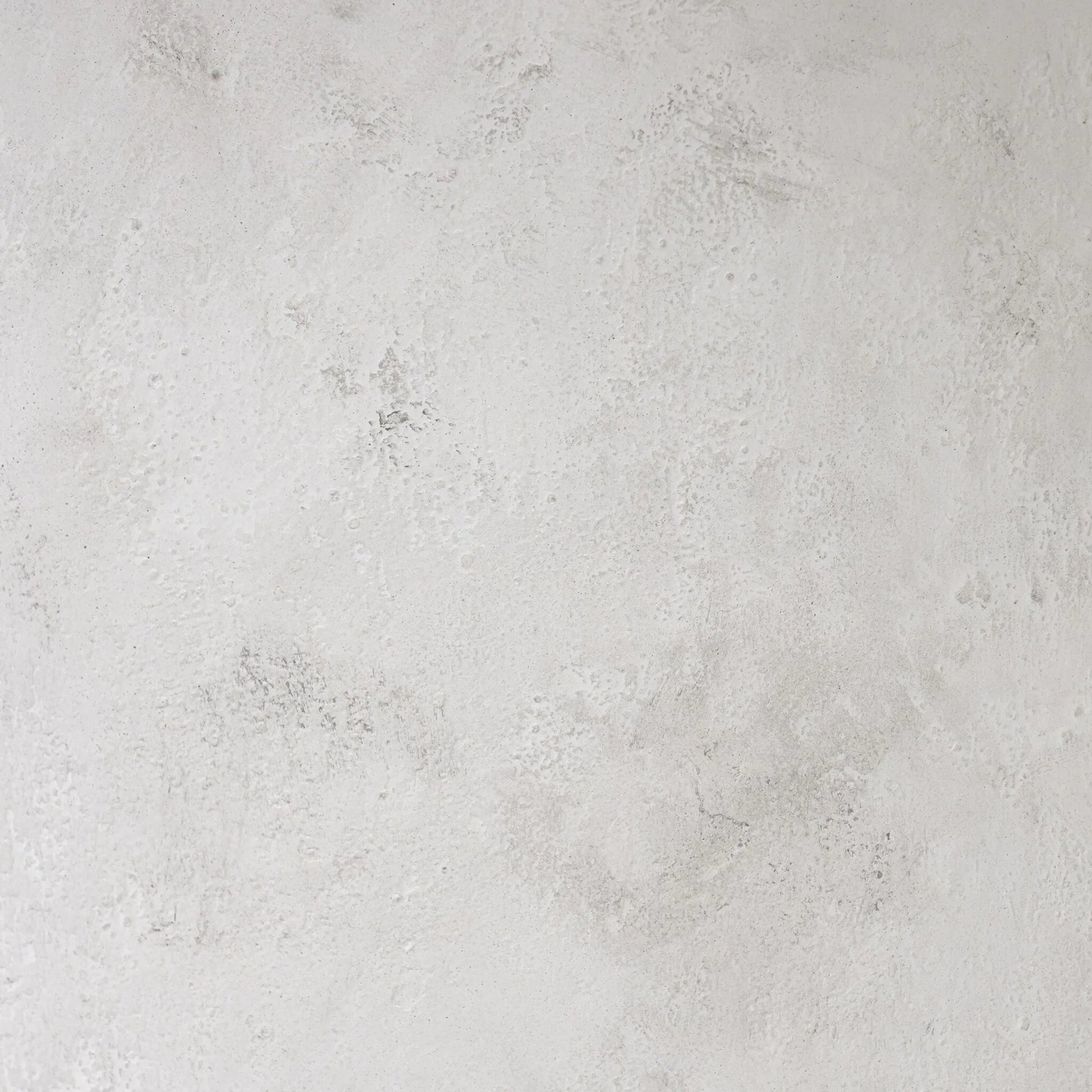 Janice Dining Table by Four Hands in textured lunar concrete. Made from solid concrete in a transitional style.