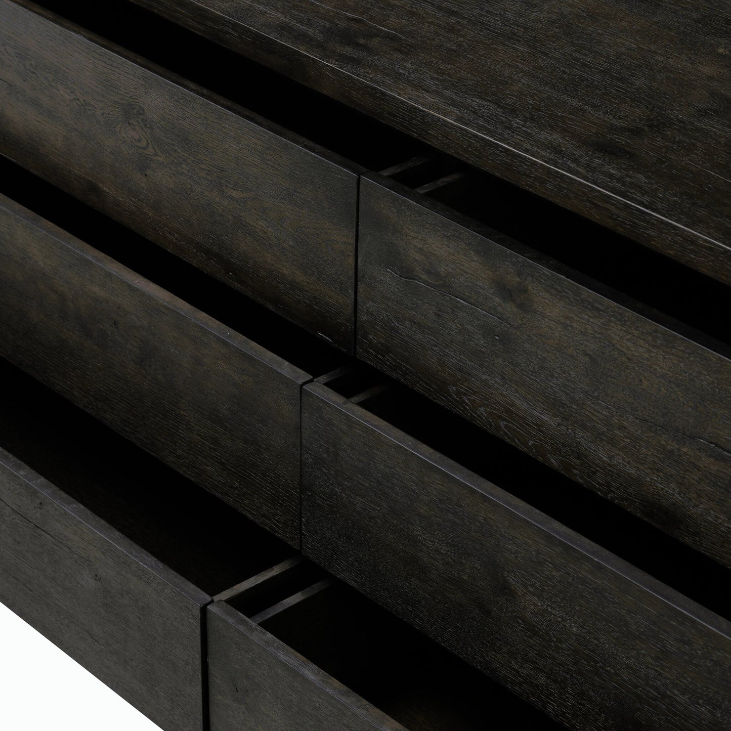 011 SI-2158337 | Closeup | Noeline 6 Drawer Dresser by Four Hands in smoked black oak veneer. Made from thick oak veneer, solid oak in a modern style.