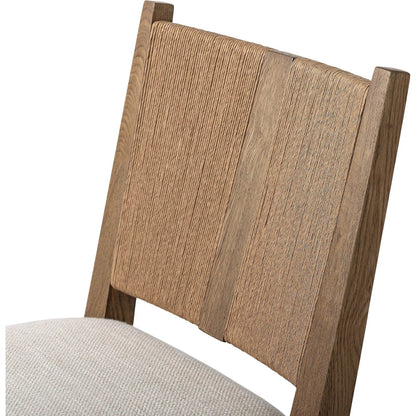 Selene Dining Chair by Four Hands in dover crescent, aged oak, natural paper cord. Made from 71% viscose (rayon), 17% polyester, 12% flax/linen, solid oak, rush in a transitional style.