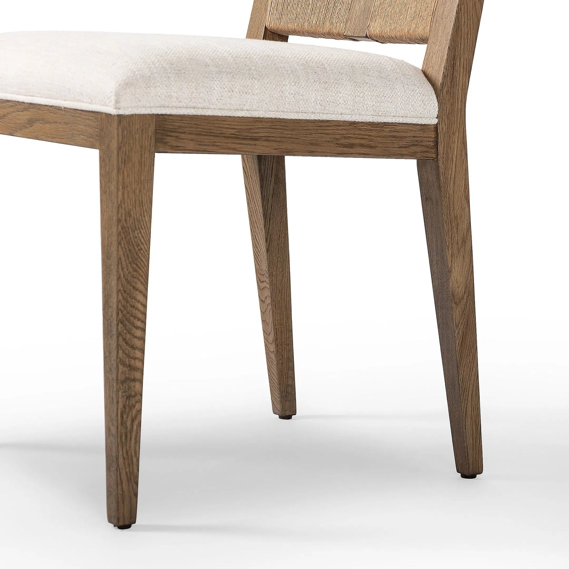 Selene Dining Chair by Four Hands in dover crescent, aged oak, natural paper cord. Made from 71% viscose (rayon), 17% polyester, 12% flax/linen, solid oak, rush in a transitional style.