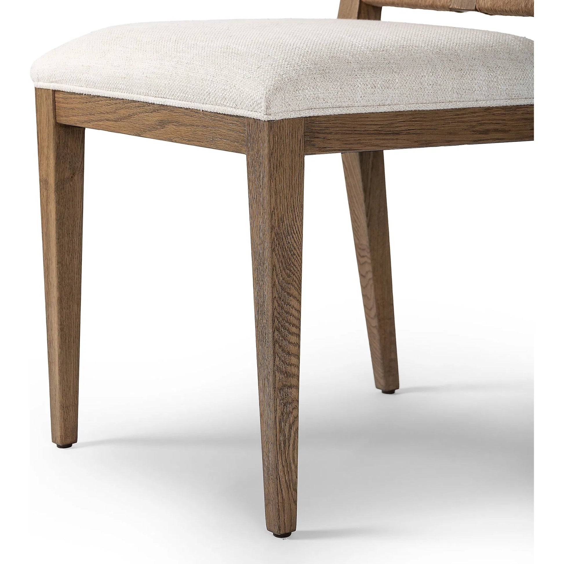 Selene Dining Chair by Four Hands in dover crescent, aged oak, natural paper cord. Made from 71% viscose (rayon), 17% polyester, 12% flax/linen, solid oak, rush in a transitional style.