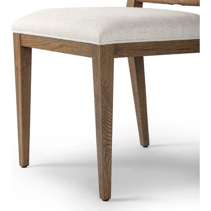 Selene Dining Chair by Four Hands in dover crescent, aged oak, natural paper cord. Made from 71% viscose (rayon), 17% polyester, 12% flax/linen, solid oak, rush in a transitional style.