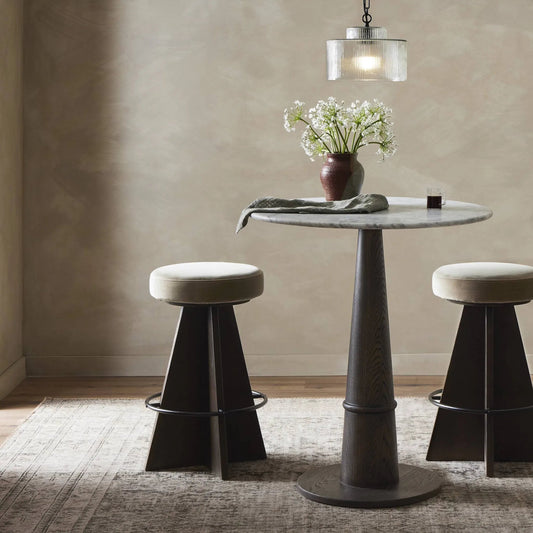 Damon Swivel Bar Stool by Four Hands in sapphire khaki, burnt oak, midnight iron. Made from 95% polyester, 5% cotton, solid oak, iron in a unique style.