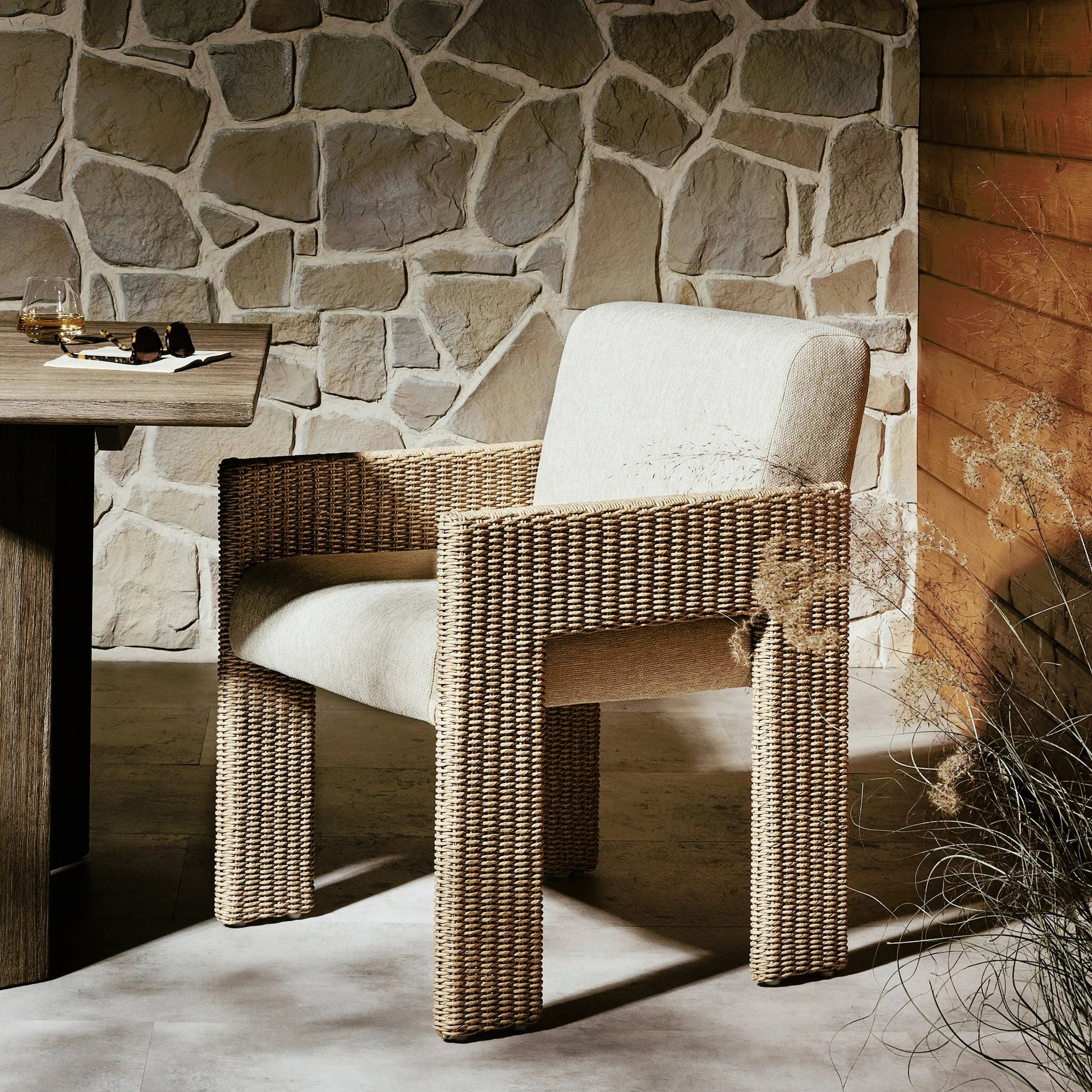 Amur Outdoor Dining Chair by Four Hands. Made from 100% olefin, 100% polyethylene, 74% polyurethane foam pad, 26% polyester fiber batting in a modern style.