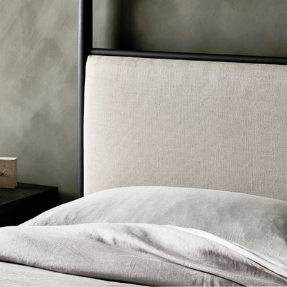 Xander Canopy Bed by Four Hands in savoy parchment, textured black iron. Made from 54% polyester, 36% viscose (rayon), 10% flax/linen, iron in a modern style.