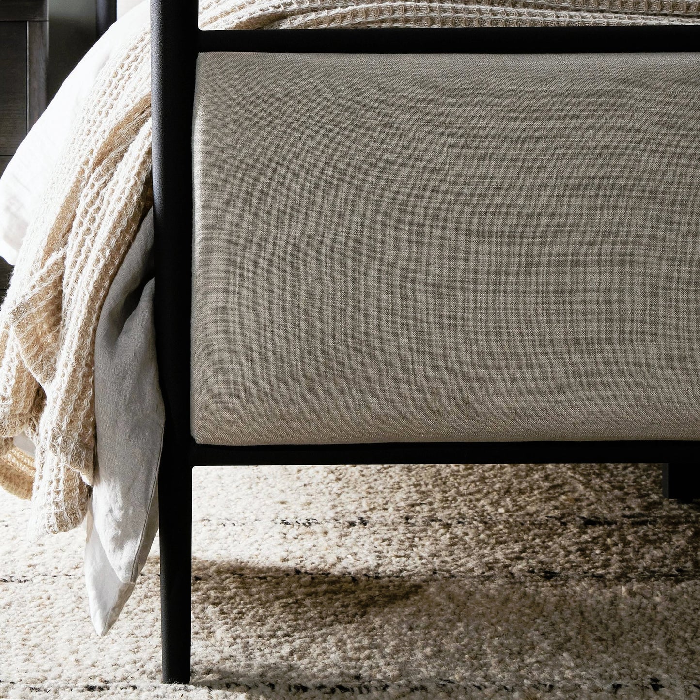 017 SI-2158601 | Closeup | Xander Canopy Bed by Four Hands in savoy parchment, textured black iron. Made from 54% polyester, 36% viscose (rayon), 10% flax/linen, iron in a modern style.
