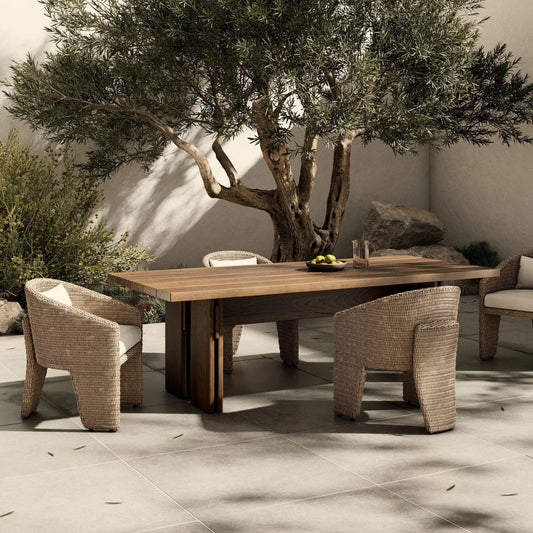 Railay Outdoor Dining Table 96" by Four Hands in stained toasted brown-fsc. Made from solid fsc®-certified teak in a unique style.