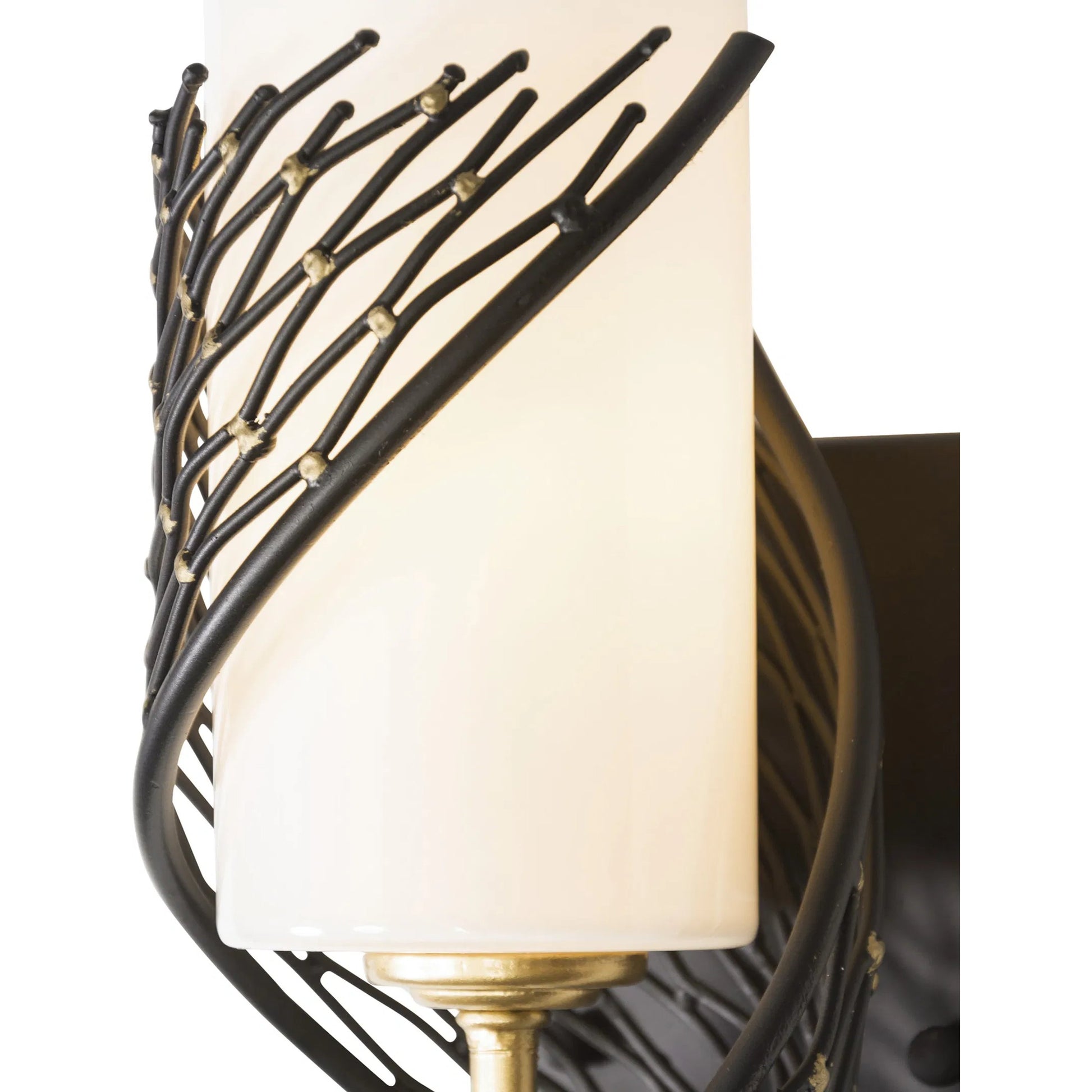 Flow I Sconce by Varaluz in matte black/french gold. Made from unique in a modern style.