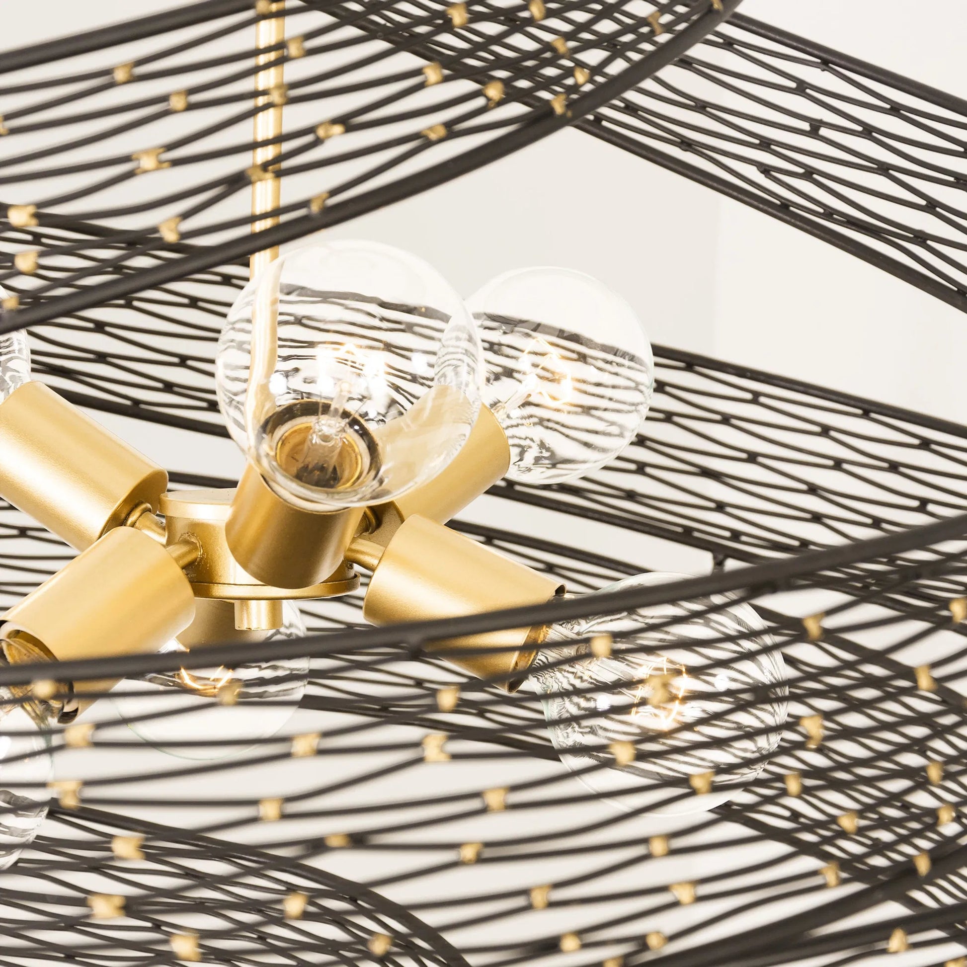 Flow Twist 6-Light Pendant by Varaluz in matte black/french gold. Made from unique in a modern style.