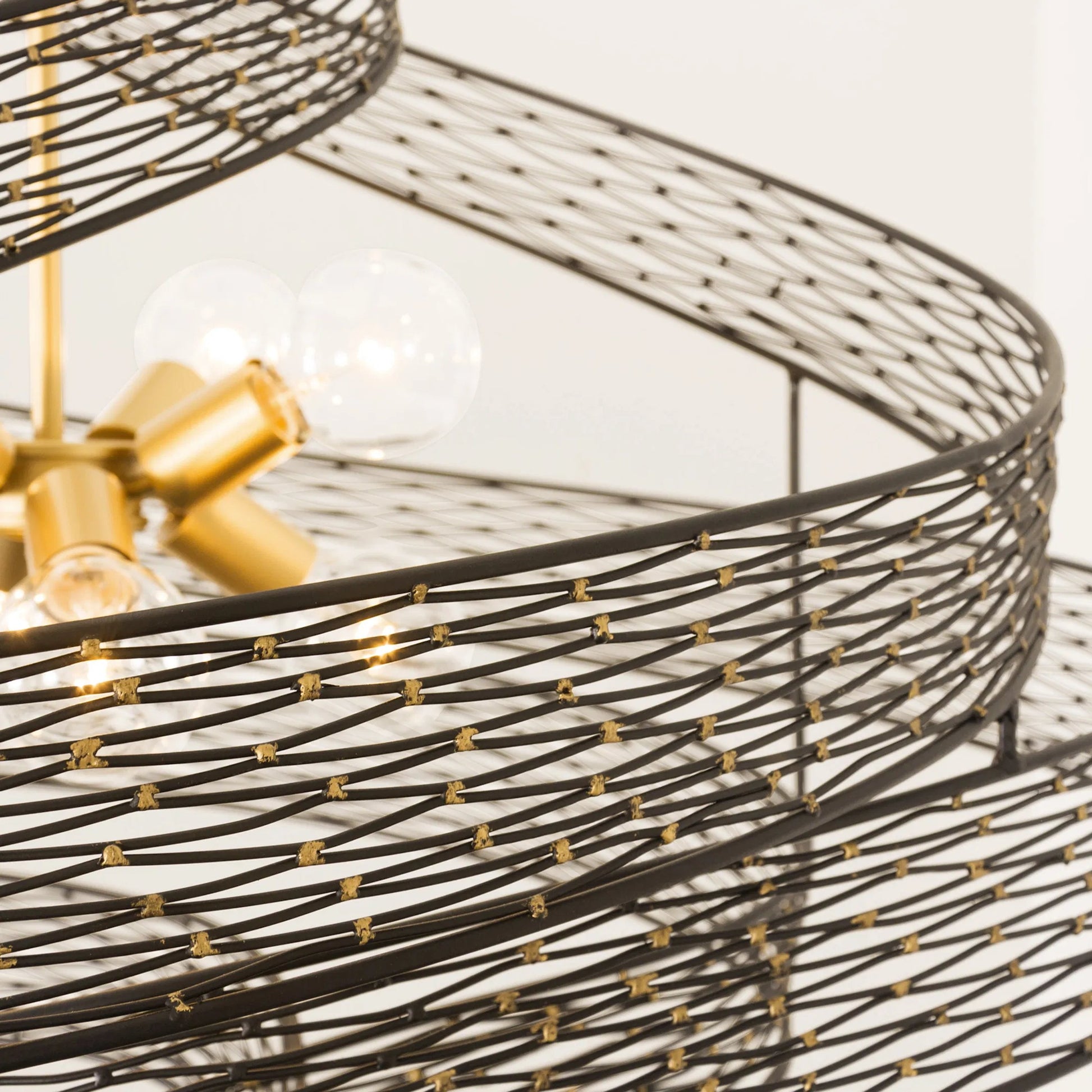 Flow I Twist 8-Light Pendant by Varaluz in matte black/french gold. Made from unique in a modern style.