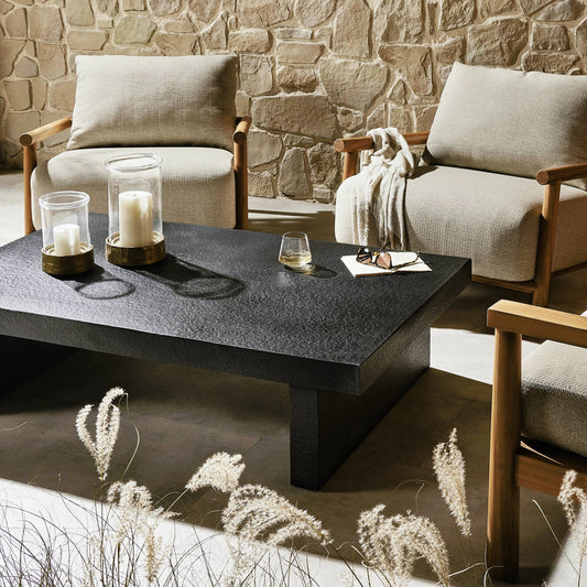 Huesca Outdoor Coffee Table by Four Hands in distressed graphite concrete. Made from concrete in a modern style.