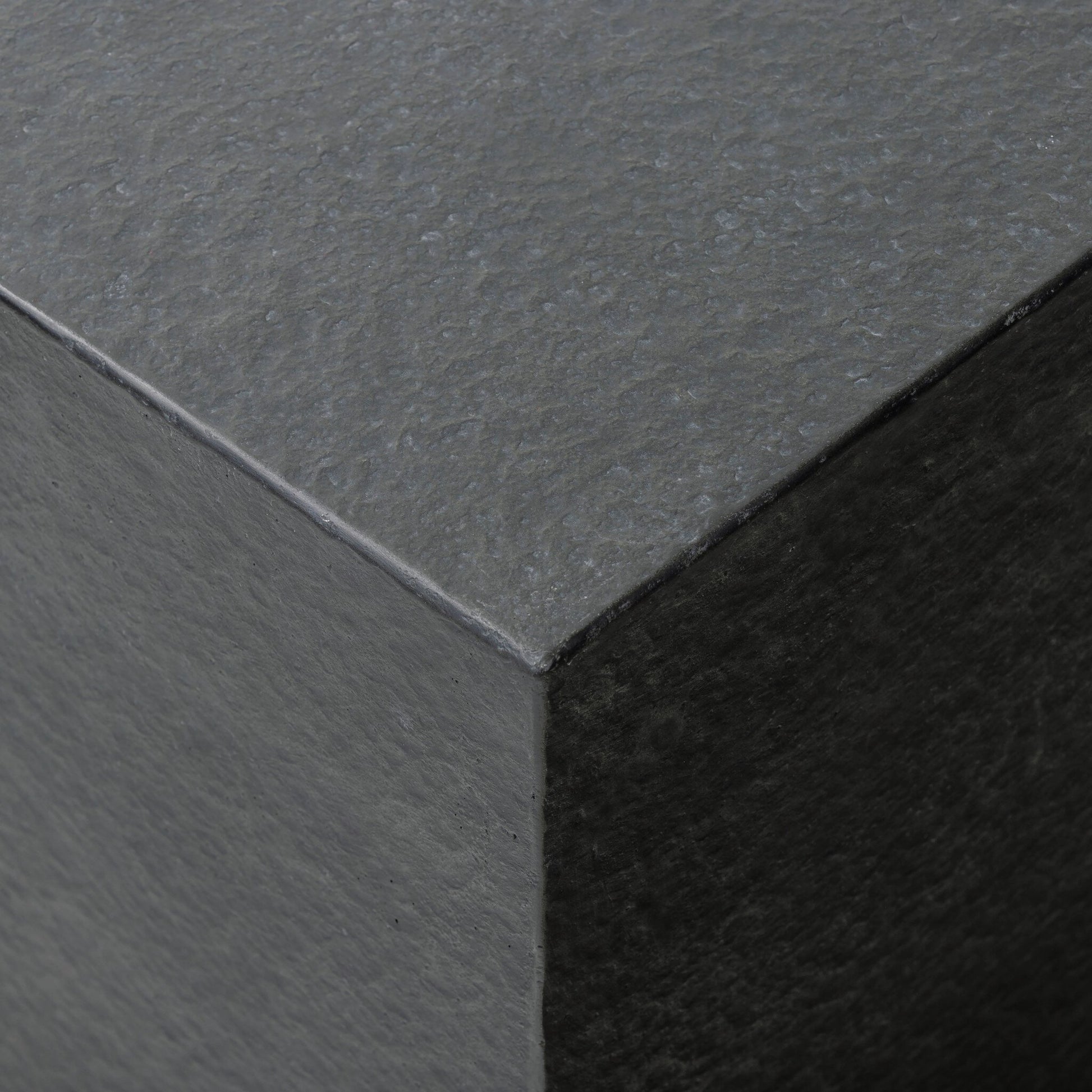 Huesca Outdoor End Table by Four Hands in distressed graphite concrete. Made from concrete in a modern style.