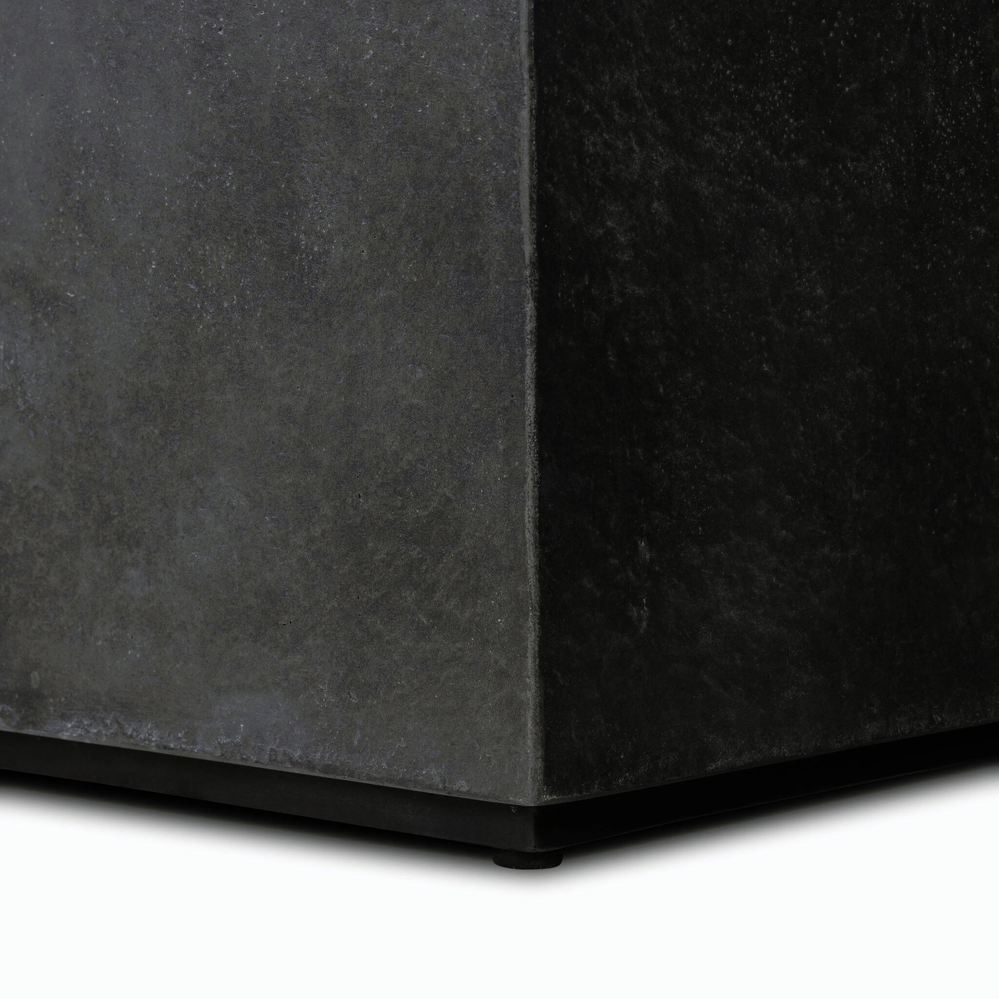 Huesca Outdoor End Table by Four Hands in distressed graphite concrete. Made from concrete in a modern style.