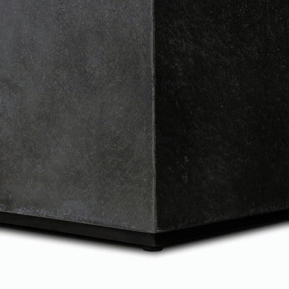 Huesca Outdoor End Table by Four Hands in distressed graphite concrete. Made from concrete in a modern style.