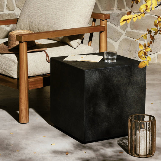 Huesca Outdoor End Table by Four Hands in distressed graphite concrete. Made from concrete in a modern style.
