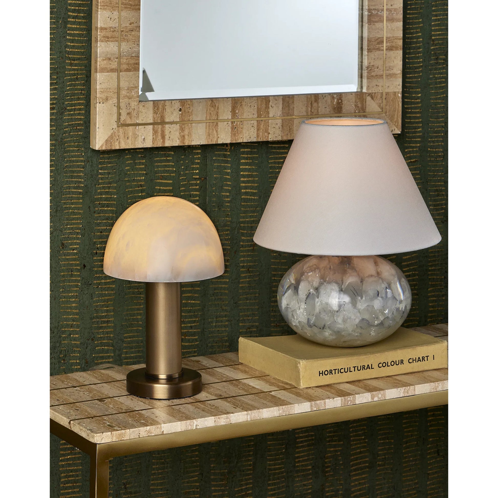 Dezi Mirror by Currey and Company in natural, brass. Made from travertine, brass, engineered wood, glass in a transitional style.