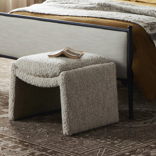 Daniel Ottoman by Four Hands in ivan sand. Made from 60% acrylic, 33% cotton, 7% polyester in a unique style.