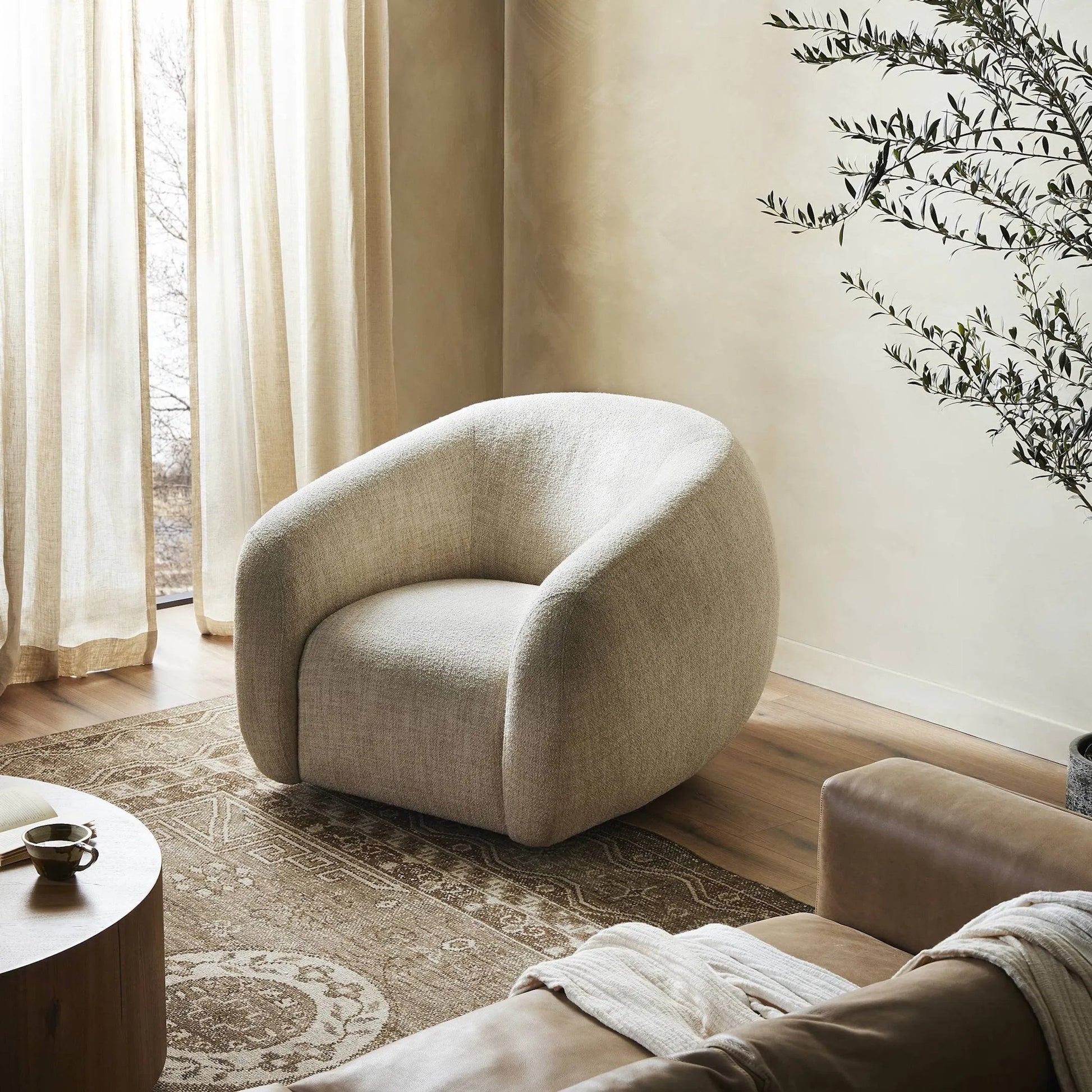 Channing Swivel Chair by Four Hands. Made from unique in a transitional style.