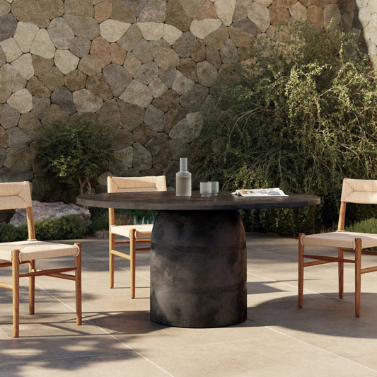 Basil Outdoor Round Dining Table by Four Hands in aged grey. Made from aluminum in a transitional style.
