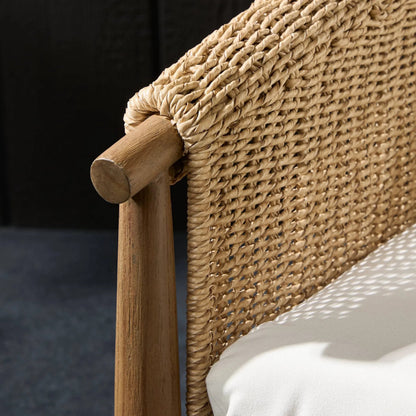 Cambrie Outdoor Chair by Four Hands in arashi salt, stained toasted brown, faux hyacinth. Made from 100% acrylic, solid teak, 100% polyethylene in a rustic style.