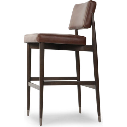 Anton Bar Stool by Four Hands in havana brown, burnt oak, raw iron. Made from top grain leather, solid oak, iron in a modern style.