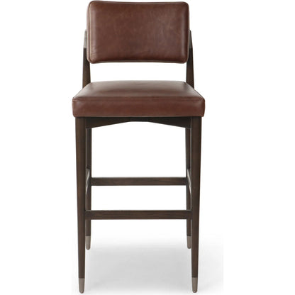 Anton Bar Stool by Four Hands in havana brown, burnt oak, raw iron. Made from top grain leather, solid oak, iron in a modern style.