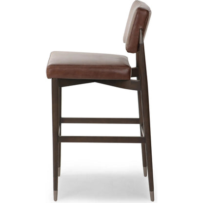 Anton Bar Stool by Four Hands in havana brown, burnt oak, raw iron. Made from top grain leather, solid oak, iron in a modern style.