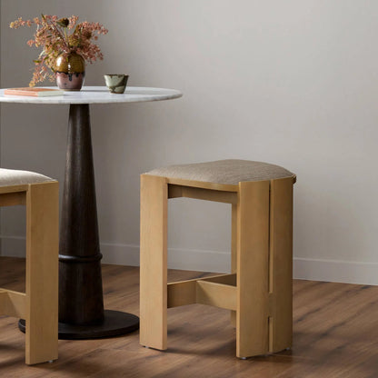 Hoven Backless Stool by Four Hands in alcala wheat, light ash. Made from 70% polyester, 20% viscose (rayon), 10% flax, linen, solid ash in a unique style.