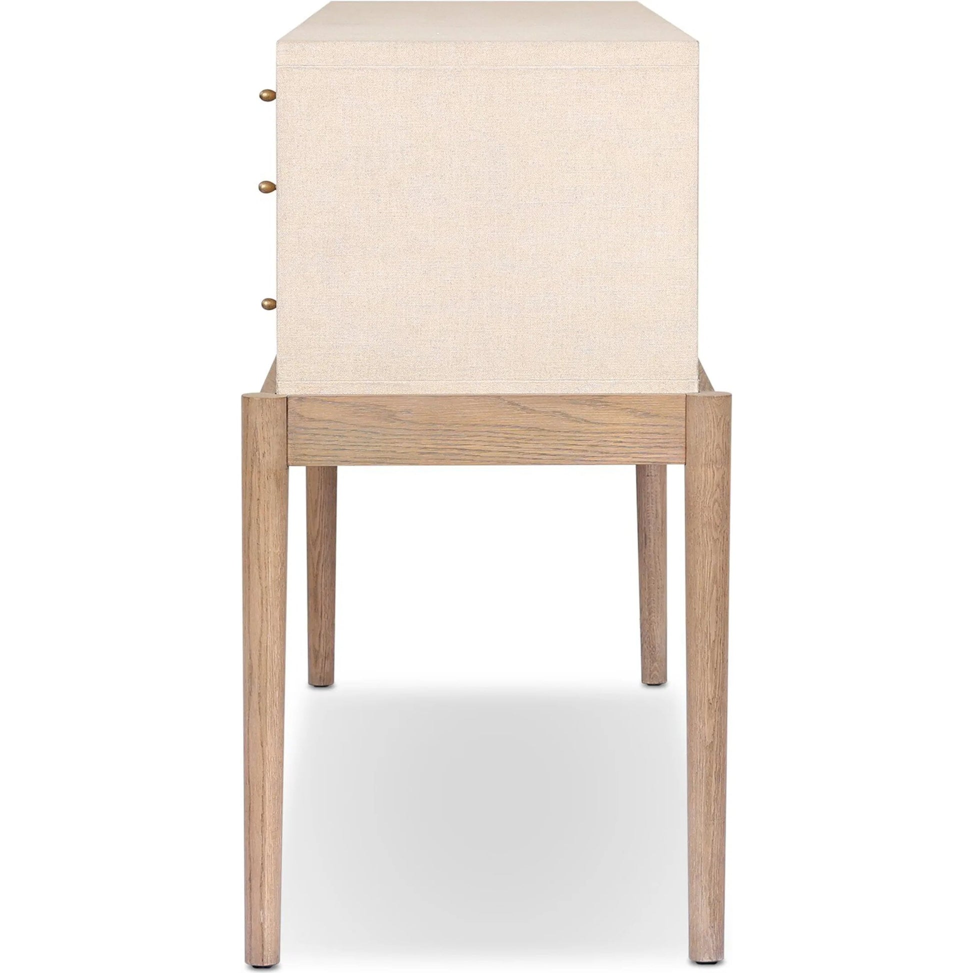 Ford Console Table by Four Hands in beige painted linen, sandy oak. Made from painted linen, solid oak in a transitional style.